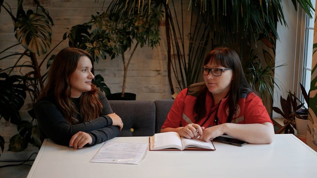 Anastasia Tetyana, wife of a missing Ukrainian soldier speaks to Natalia, a Ukraine Red Cross Society volunteer in the family tracing service